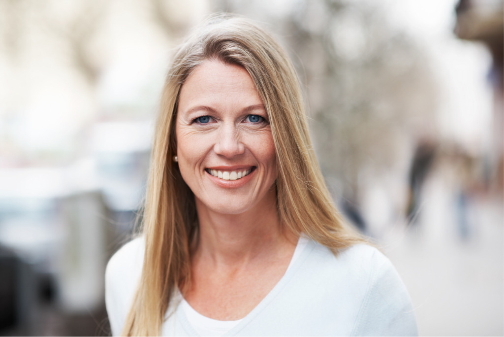 Pasienthistorier, bilde av en vakker moden dame som smiler